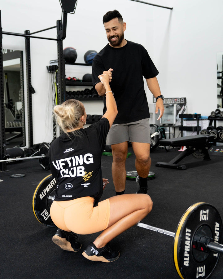 Duo wearing Unisex Lifting Club FLXCotton Tee Oversize - Black-White-Yellow