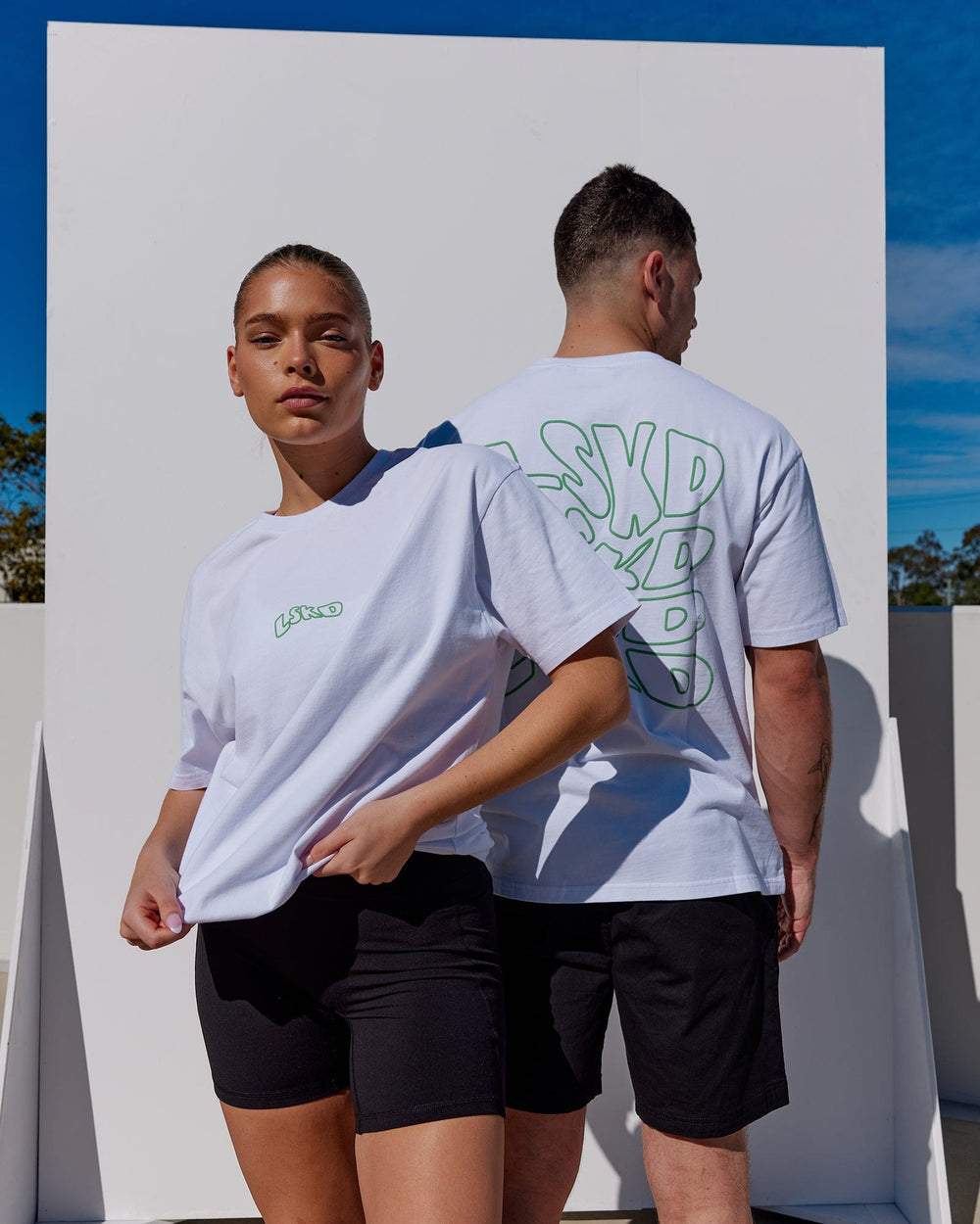 Duo wearing Unisex Mad Happy Heavyweight Tee Oversize - White