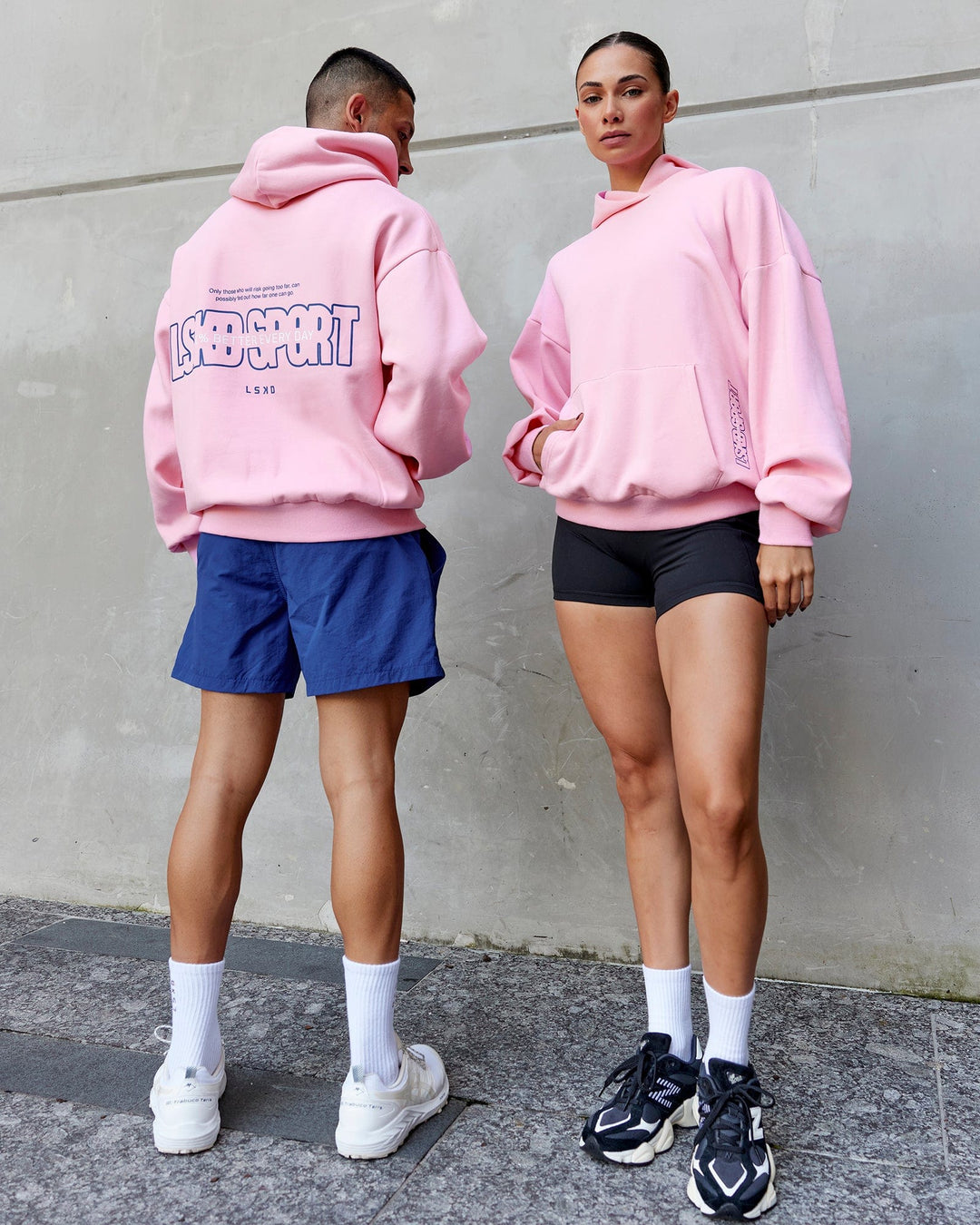 Duo wearing Unisex Urban Hoodie Oversize - Pink Frosting-Galactic Blue