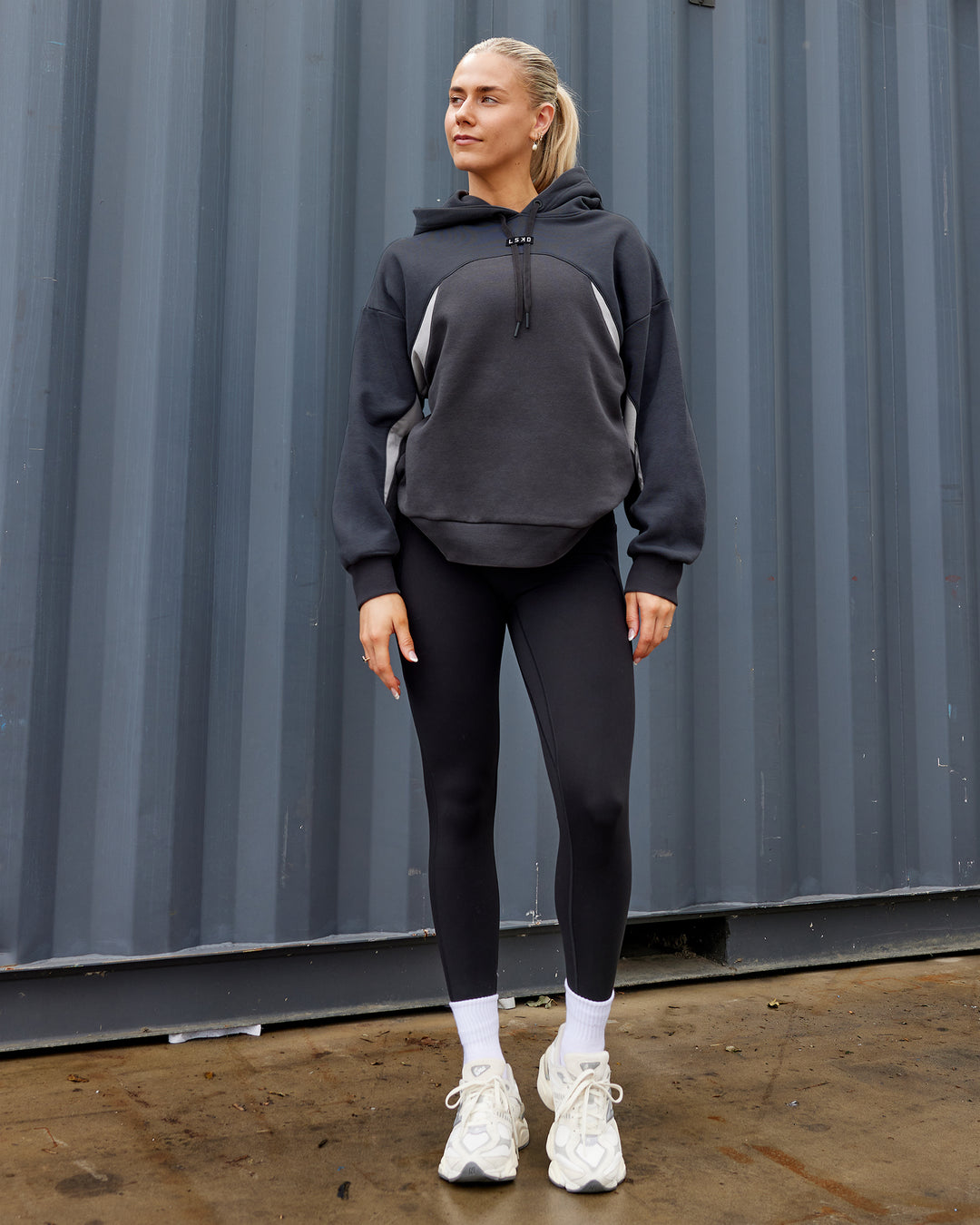 Woman wearing Unisex Y2K Concept Panel Hoodie - Asphalt-Turbulance - view 2