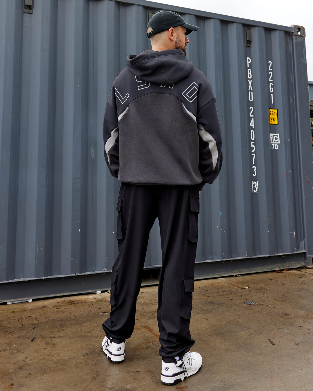 Man wearing Unisex Y2K Concept Panel Hoodie - Asphalt-Turbulance - view 3