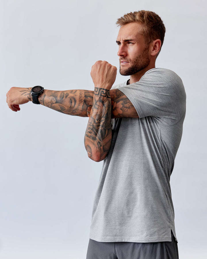 Man wearing Perform VapourFLX Tee - Lt Grey Marl
