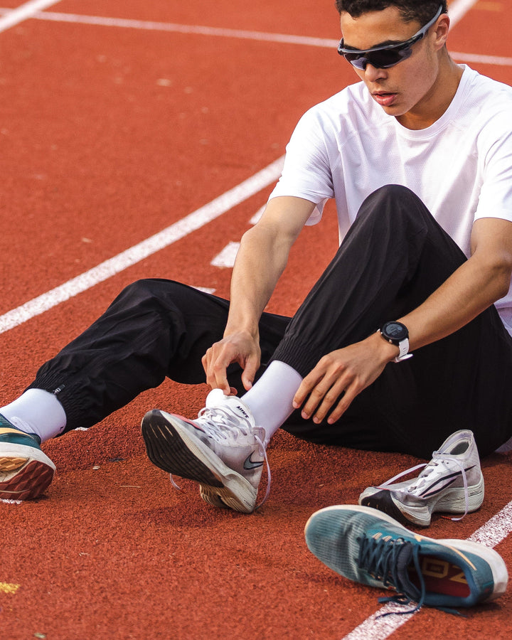 Man wearing Warm Up Zip Cuff Performance Pant - Black