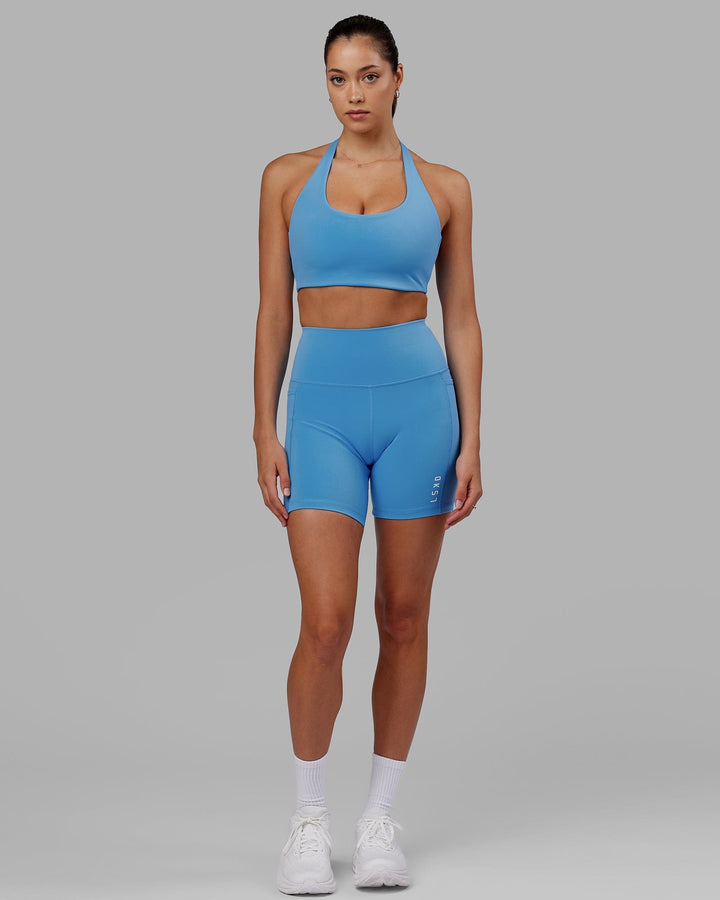 Woman wearing Challenger Sports Bra - Azure Blue