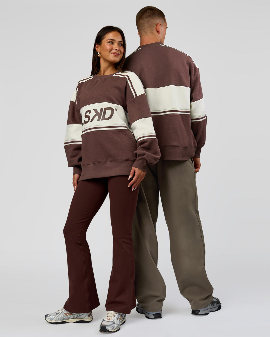 Duo wearing A-Team Sweater Oversize in Cocoa Powder-Off White | Model:Bianca | Size:XS | Model:Albert | Size: M
