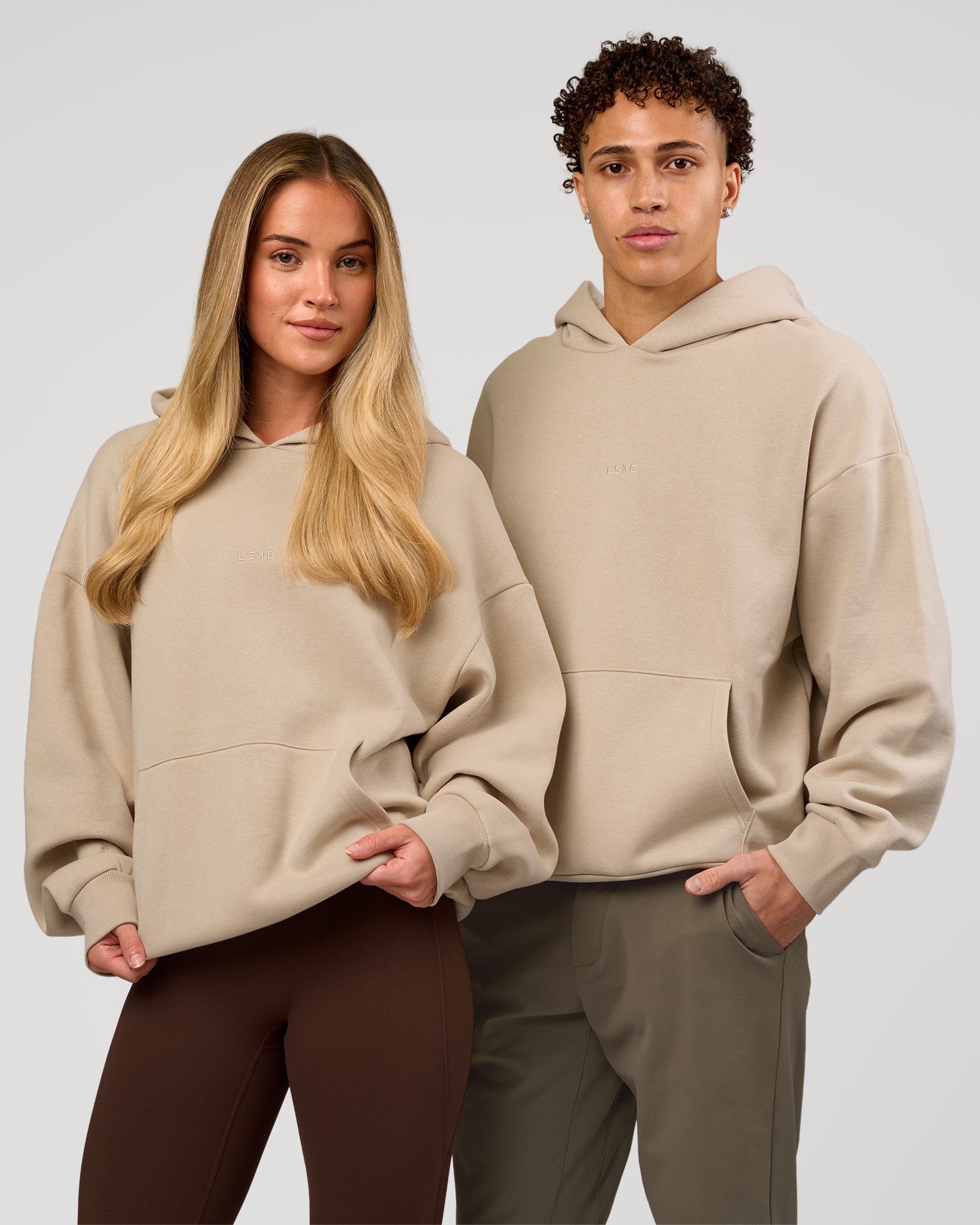 Duo wearing Base Oversized Hoodie - Shale Beige | Model:Leandro | Size:M | Model:Issy | Size: XS |