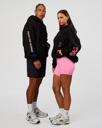 Duo wearing CFT BNE 26 Unisex Oversized Hoodie - Black-Candy Pink | Model:Brylee | Size:XS | Model:Malebo | Size:M | Thumbnail Index: 0