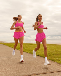 Woman wearing Accelerate 3" Running Short - Ultra Pink | Model:Duo | Size:Both