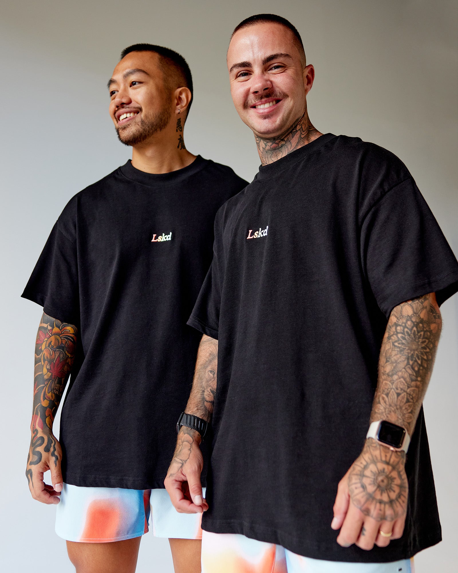Duo wearing Our Journey Heavyweight Oversized Tee - Black-Rainbow | Model:Both | Size:Duo