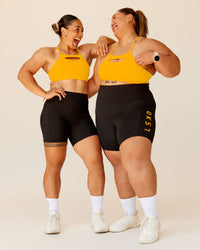 Woman wearing Rep Ultra High-Rise 6" Short Pockets - Black-Zinnia | Model:Duo | Size:Both