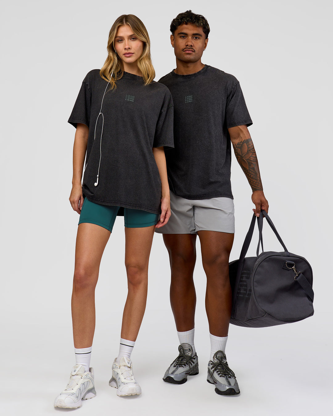 Duo wearing Everyday Elevation FLXCotton Oversized Tee - Black Washed-Carbon Green | Model:Leilani | Size:XS | Model:Xav | Size:L