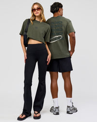 Duo wearing Everyday Elevation FLXCotton Oversized Tee - Carbon Green Washed -White | Model:Leilani | Size:XS | Model:Xav | Size:L