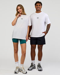 Duo wearing Everyday Elevation FLXCotton Oversized Tee - White-Carbon Green | Model:Leilani | Size:XS | Model:Xav | Size:L
