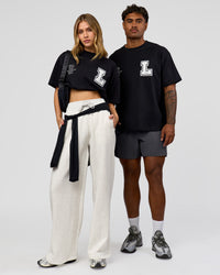 Duo wearing Hype Heavyweight Unisex Oversized Tee - Black-White | Model:Leilani | Size:XS | Model:Xavier | Size:L | Thumbnail Index: 0