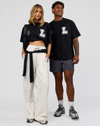 Duo wearing Hype Heavyweight Unisex Oversized Tee - Black-White | Model:Leilani | Size:XS | Model:Xavier | Size:L | Thumbnail Index: 2