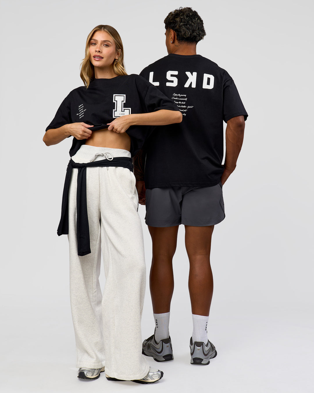 Duo wearing Hype Heavyweight Unisex Oversized Tee - Black-White | Model:Leilani | Size:XS | Model:Xavier | Size:L - view 4