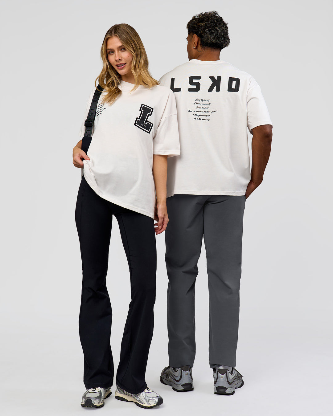 Duo wearing Hype Heavyweight Unisex Oversized Tee - Off White-Black | Model:Xavier | Size:L | Model:Brylee | Size:XS