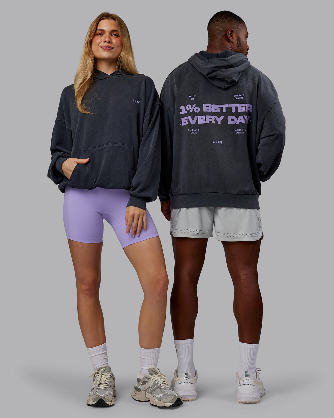 Duo wearing 1% Better Value Series Oversized Hoodie - Black-Violet Ray | Model:Both | Size:Duo