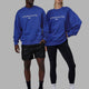 Duo wearing Unisex 1% Better Sweater Oversize - Power Cobalt-White