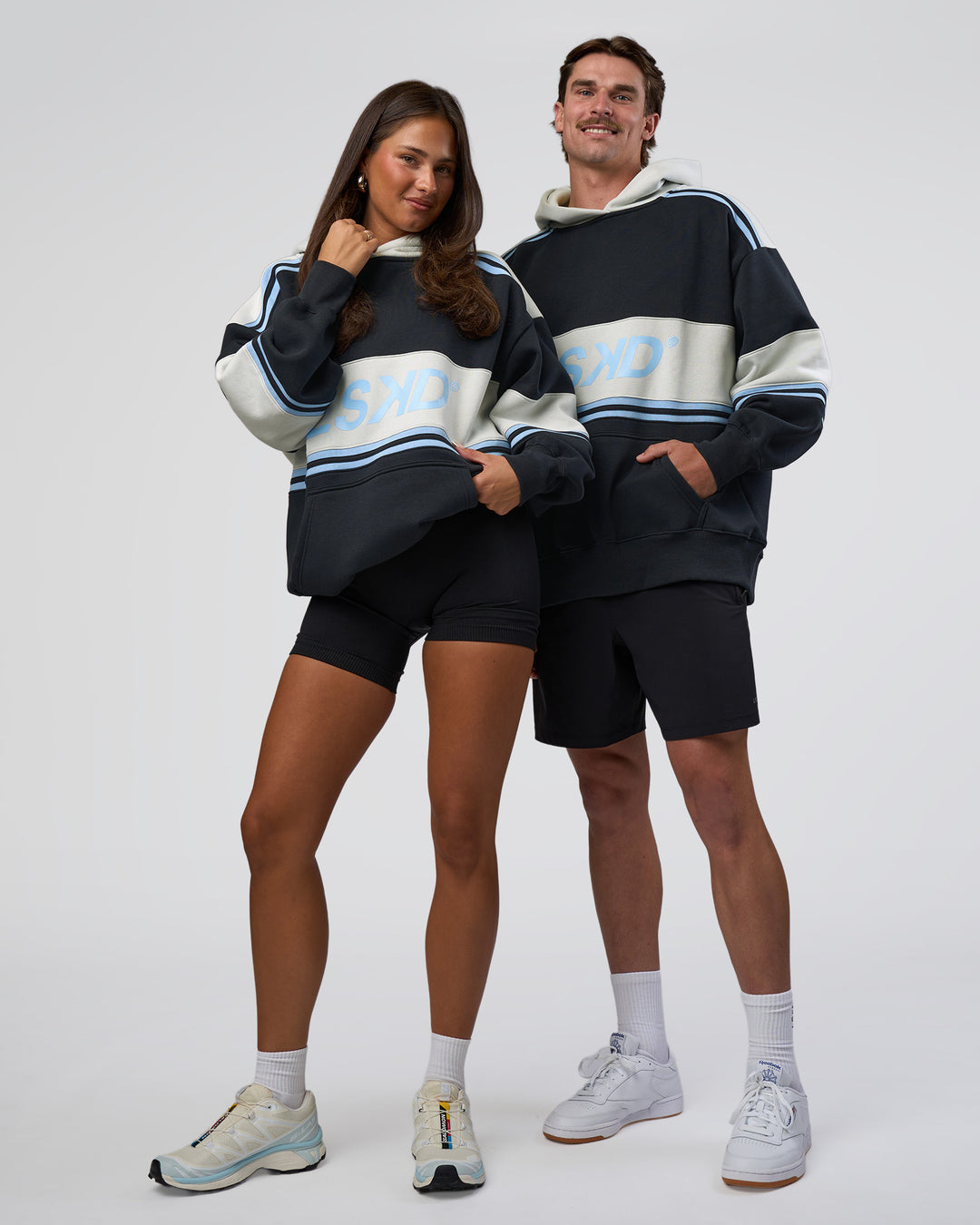 Duo wearing A-Team Oversized Hoodie - Caviar-Open Air | Model:Both | Size:Duo