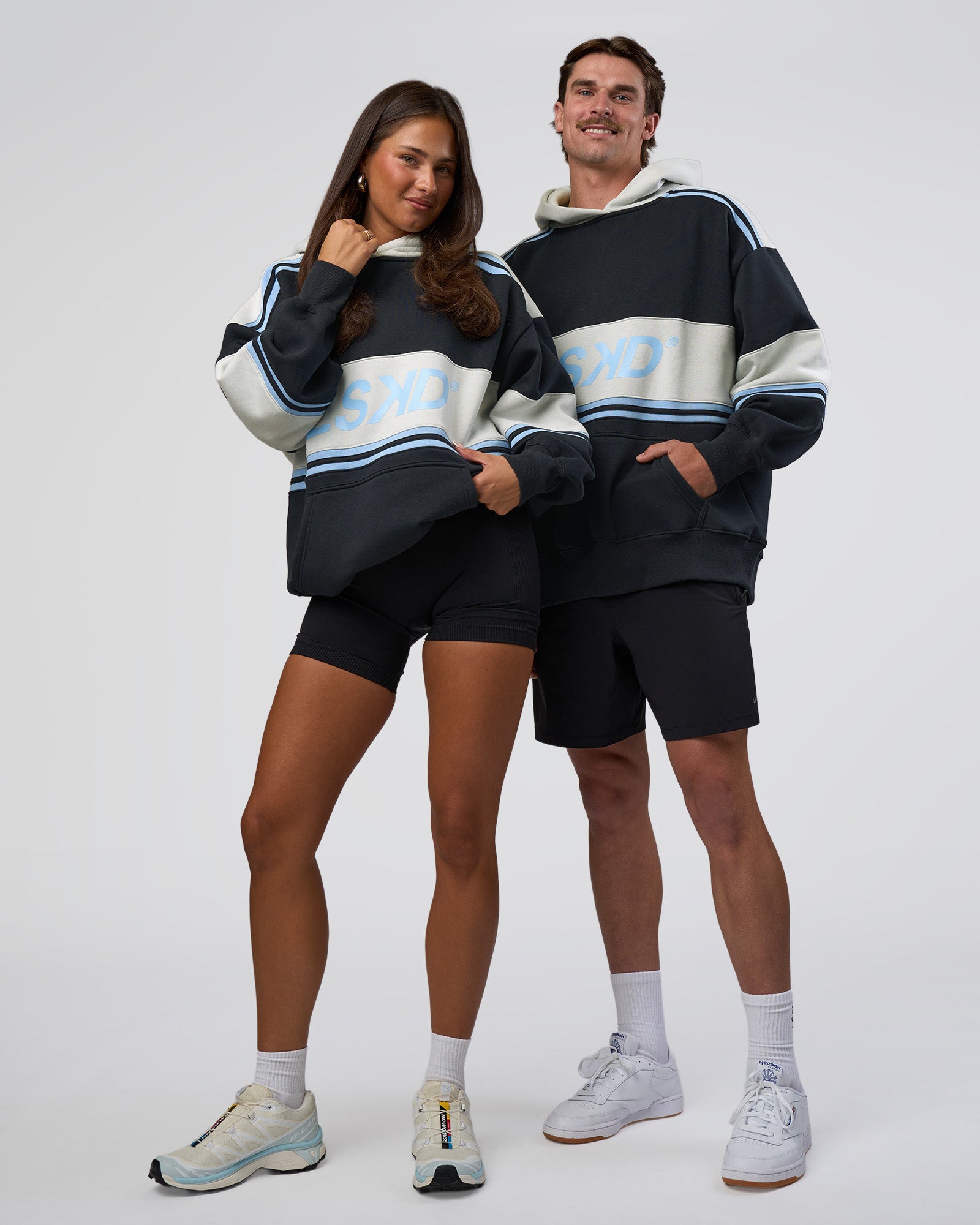 Duo wearing A-Team Oversized Hoodie - Caviar-Open Air | Model:Both | Size:Duo