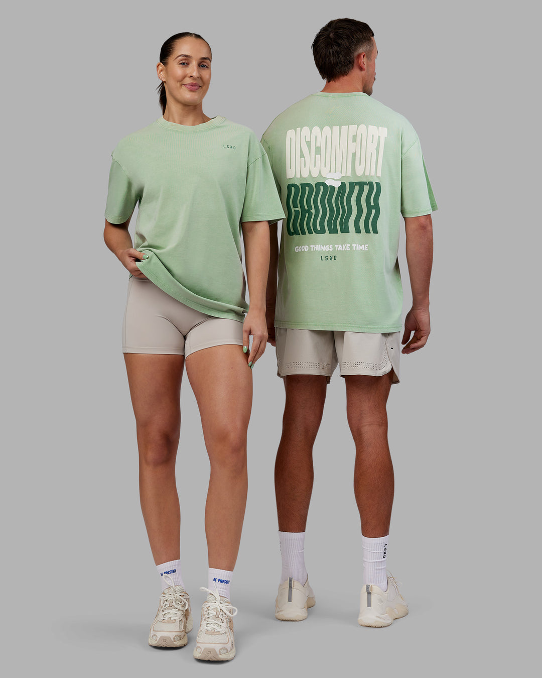 Duo wearing Abs Unisex Growth FLXCotton Oversized Tee - Matcha Green Washed | Model:Both | Size:Duo