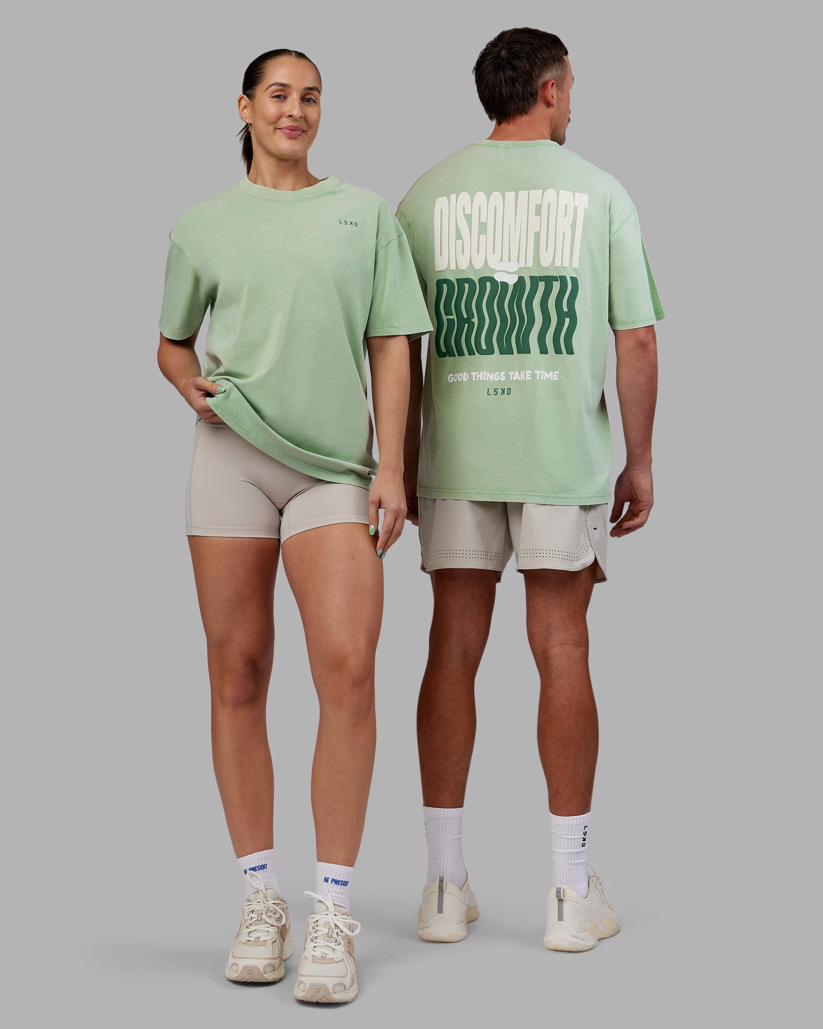 Duo wearing Abs Unisex Growth FLXCotton Oversized Tee - Matcha Green Washed | Model:Both | Size:Duo
