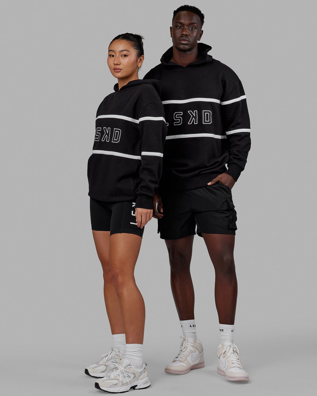 Duo wearing Unisex Aligned Hoodie Oversize - Black