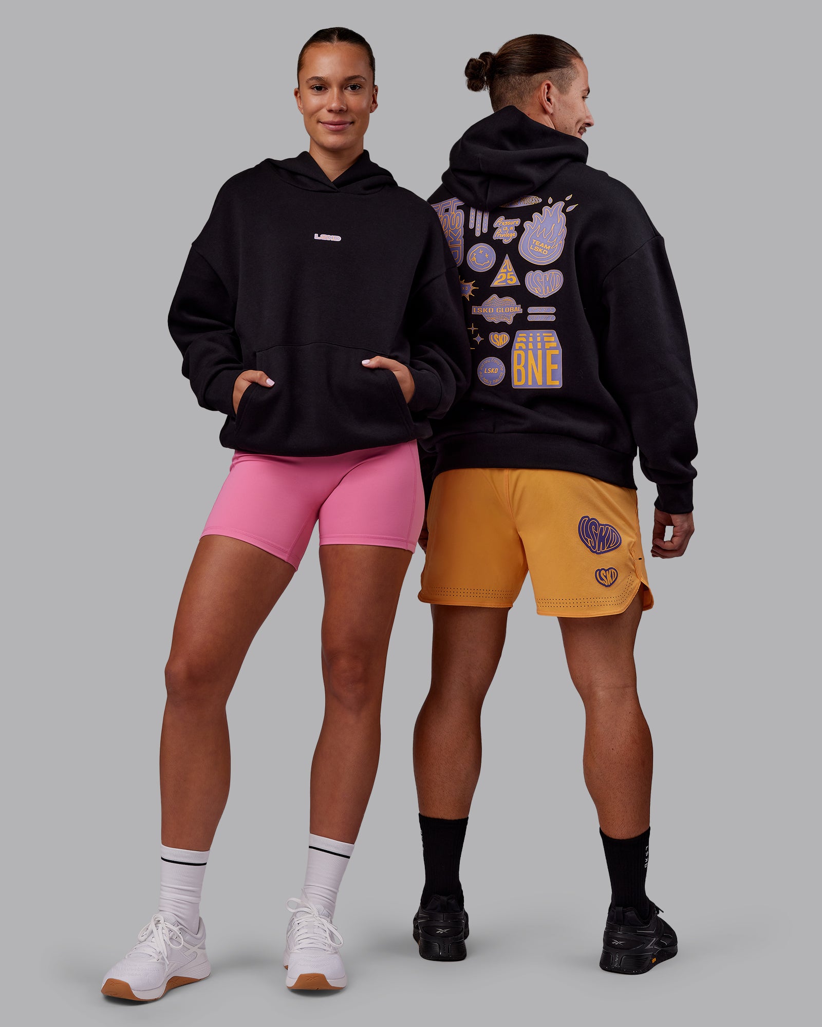 Duo wearing CFT BNE 25 Oversized Hoodie - Black-Warm Apricot | Model:Both | Size:Duo