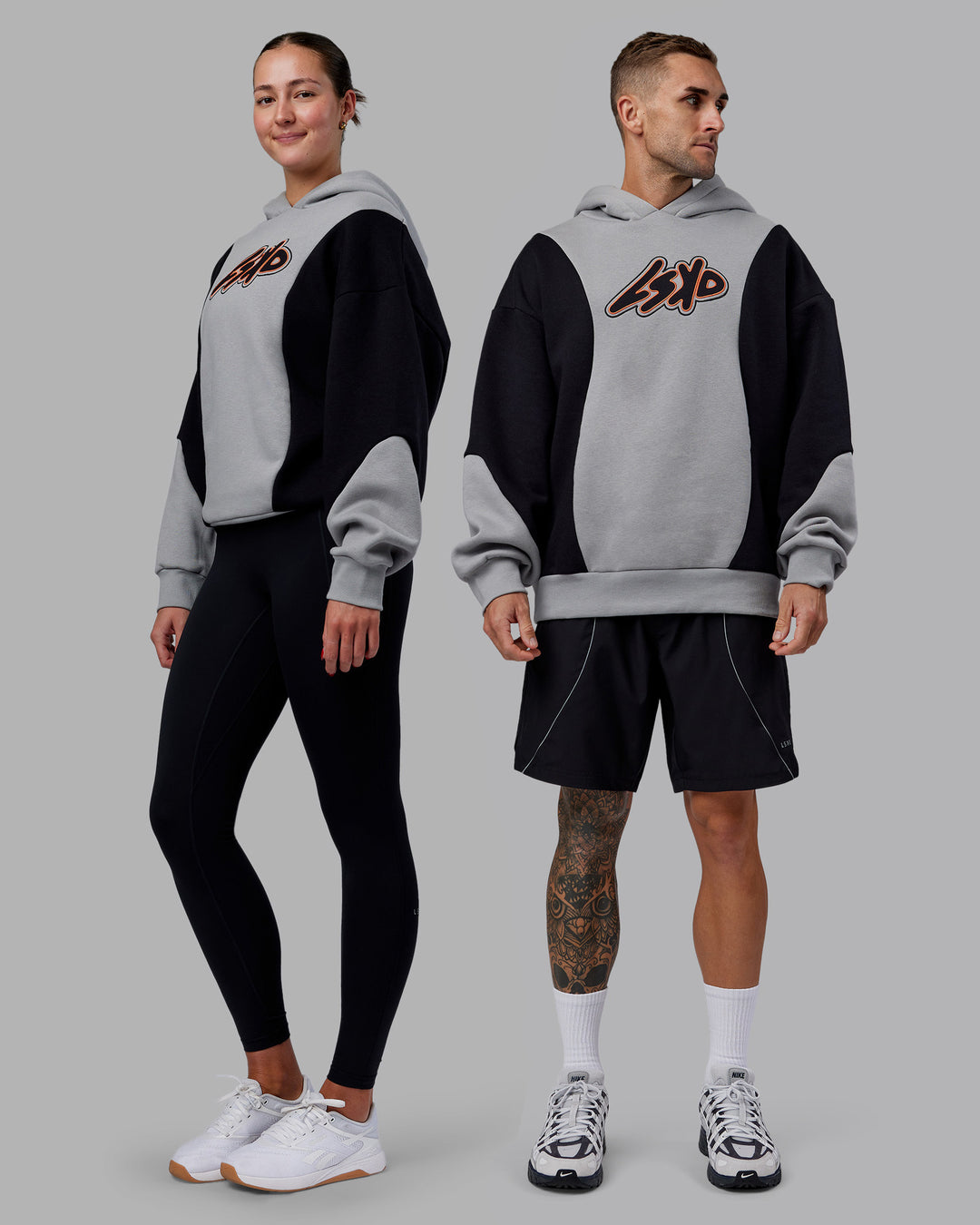 Duo wearing Downtown Oversized Panel Hoodie - Circular Grey - Black | Model:Both | Size:Duo