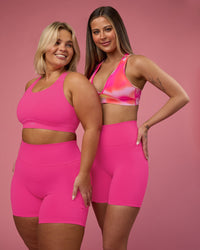 Woman wearing Fusion Ultra High-Rise 6" Short Pockets - Ultra Pink | Model:Duo | Size:Both
