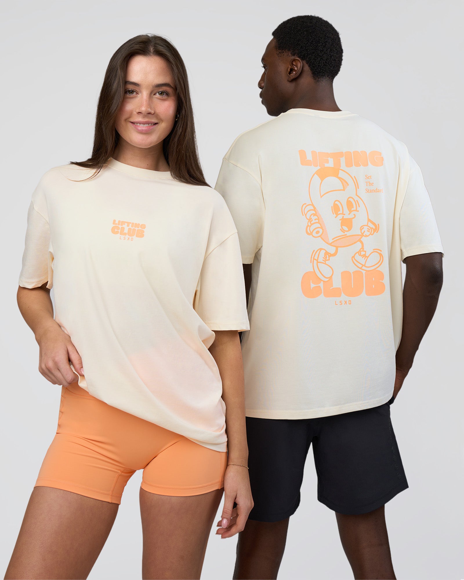 Duo wearing Kettle B FLXCotton Oversized Tee - Sugar Swizzle-Cantaloupe | Model:Both | Size:Duo