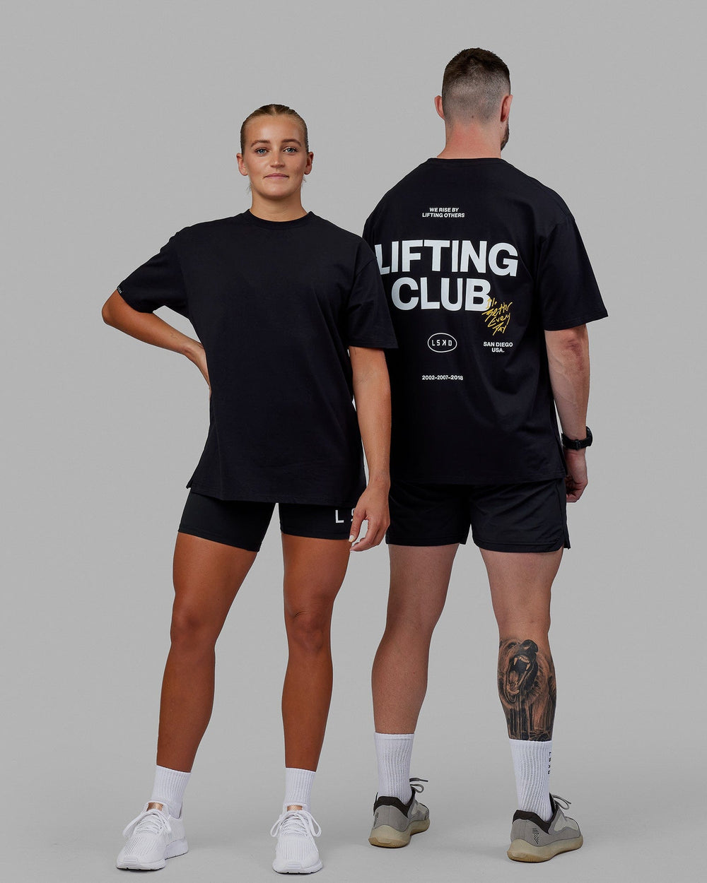 Duo wearing Unisex Lifting Club FLXCotton Tee Oversize - Black-White-Yellow