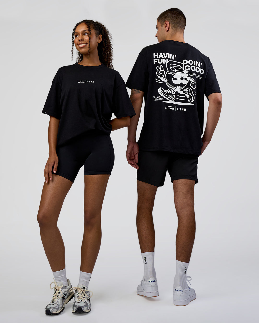 Duo wearing Movember 2025 FLXCotton Oversize Tee - Black | Model:Both | Size:Duo