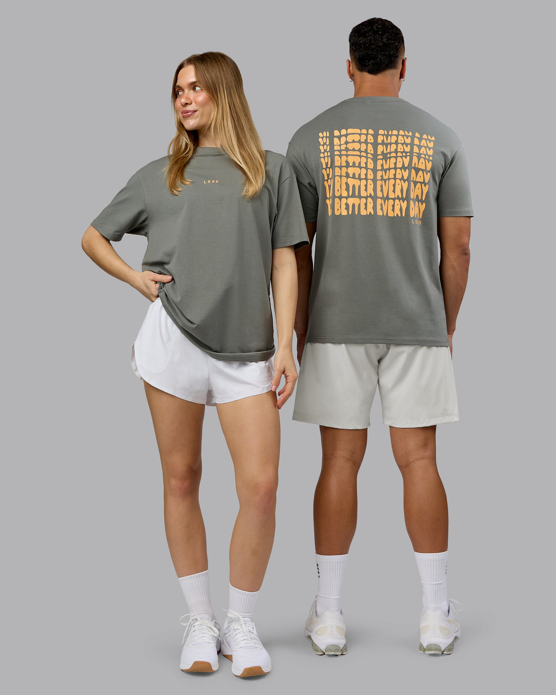 Duo wearing On Repeat FLXCotton Oversized Tee - Graphite-Warm Apricot | Model:Both | Size:Duo