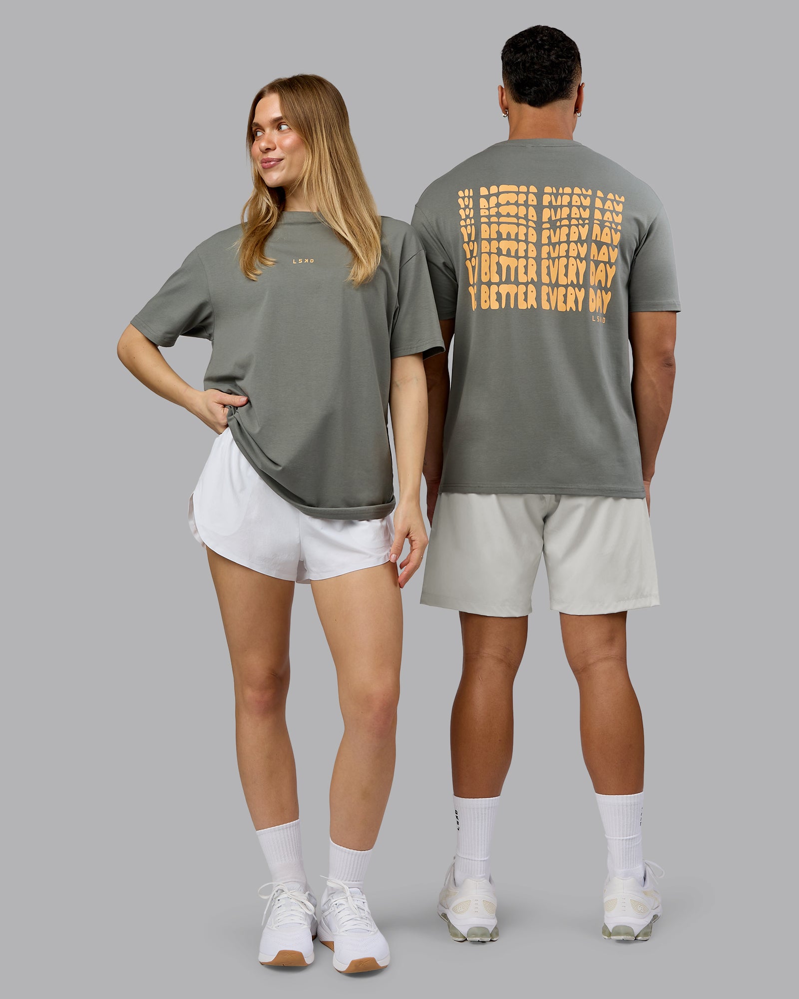 Duo wearing On Repeat FLXCotton Oversized Tee - Graphite-Warm Apricot | Model:Both | Size:Duo