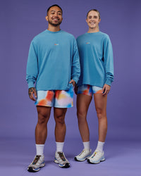 Duo wearing Our Journey Oversize Heavyweight FLXCotton Long Sleeve Tee - Azure Blue | Model:Both | Size:Duo