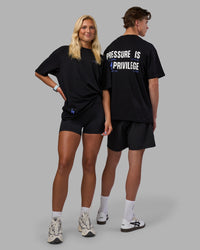 Duo wearing Pressure is a Privilege FLXCotton Oversized Tee - Black-Power Cobalt | Model:Both | Size:Duo