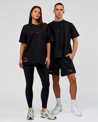 Duo wearing Pride Sticker Boxy Tee - Black | Model:Bianca | Size:S | Model:Albert | Size:M