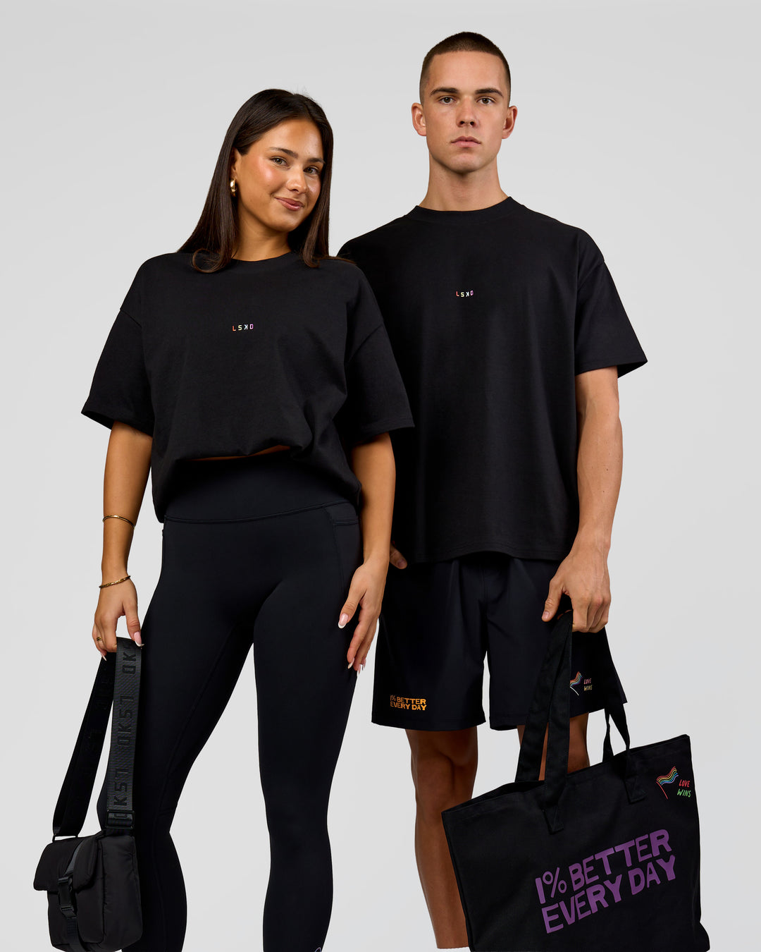 Duo wearing Pride Sticker Boxy Tee - Black | Model:Bianca | Size:S | Model:Albert | Size:M