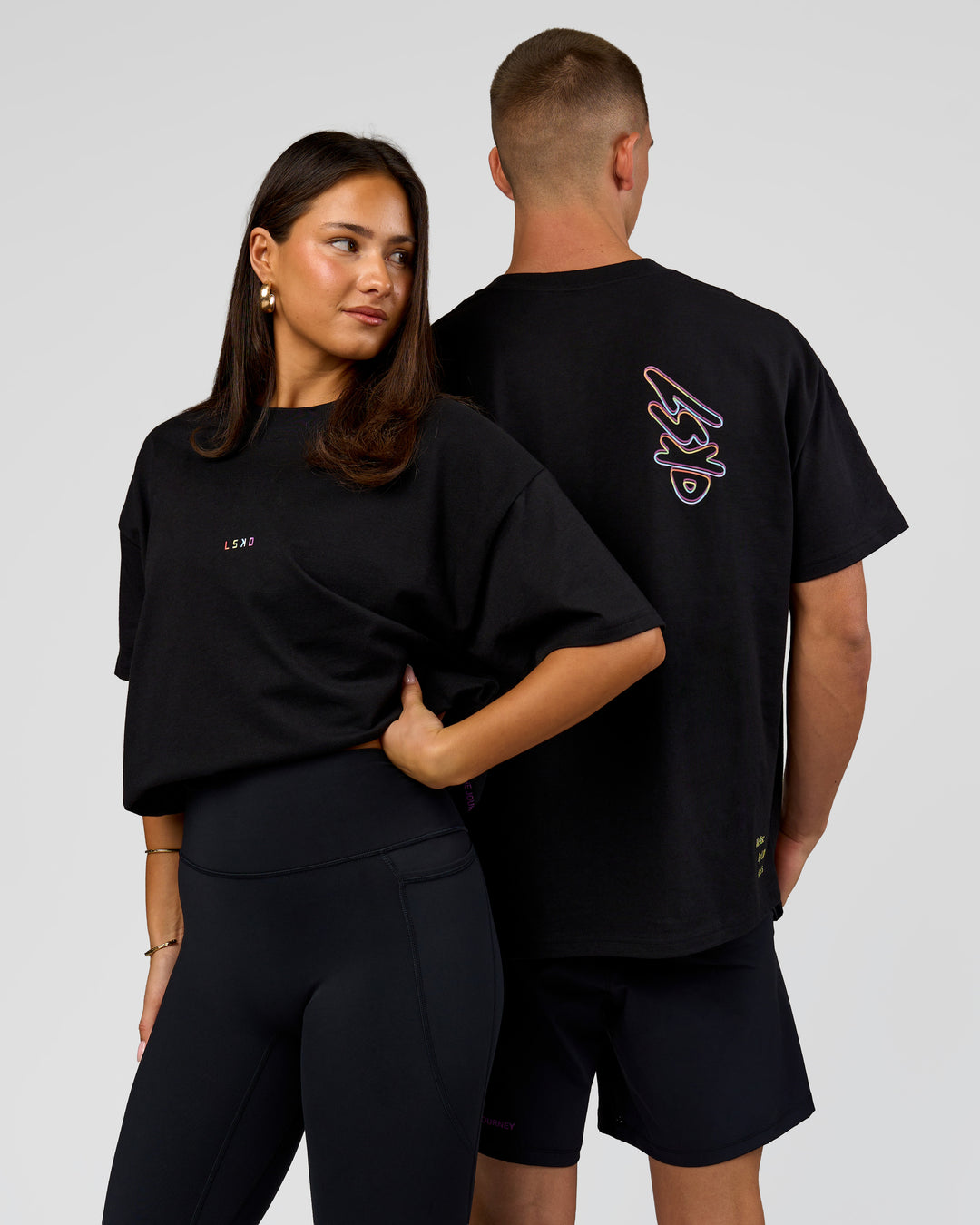 Duo wearing Pride Sticker Boxy Tee - Black | Model:Bianca | Size:S | Model:Albert | Size:M
