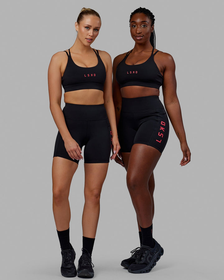 Woman wearing Rep Mid Short Tights - Black-Raspberry