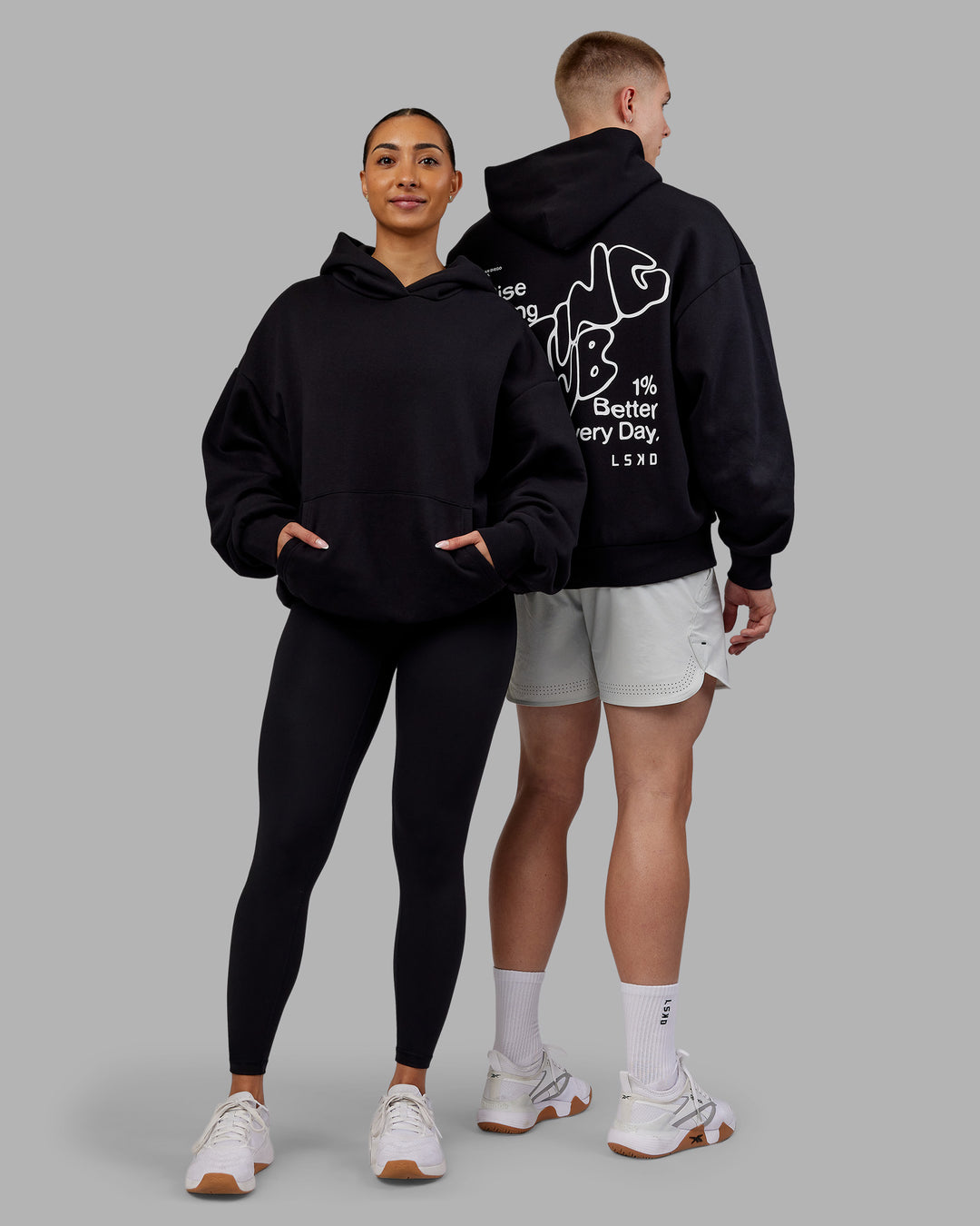 Duo wearing Rise &amp; Lift Hoodie Oversized - Black-White | Model:Both | Size:Duo