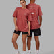 Duo wearing Unisex Rotate Tee Oversize - Mineral Red-White