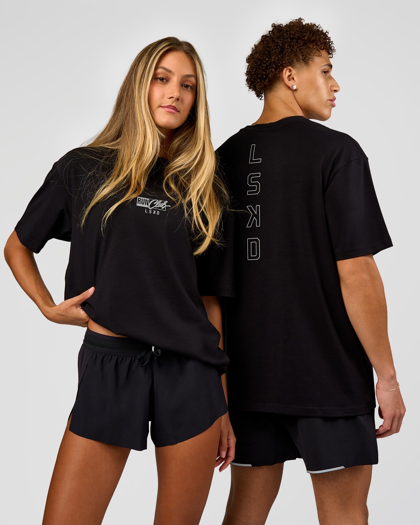 Duo wearing Run Club Script FLXCotton Oversized Tee - Black-Alloy | Model:Both | Size:Duo