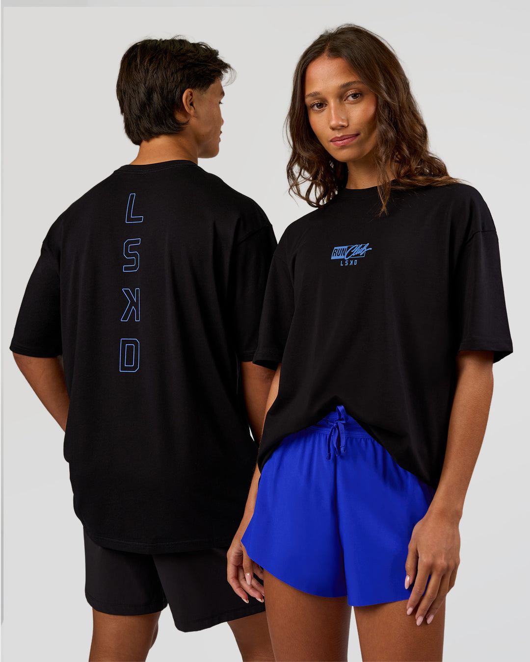 Duo wearing Run Club Script FLXCotton Oversized Tee - Black-Palace Blue | Model:Both | Size:Duo