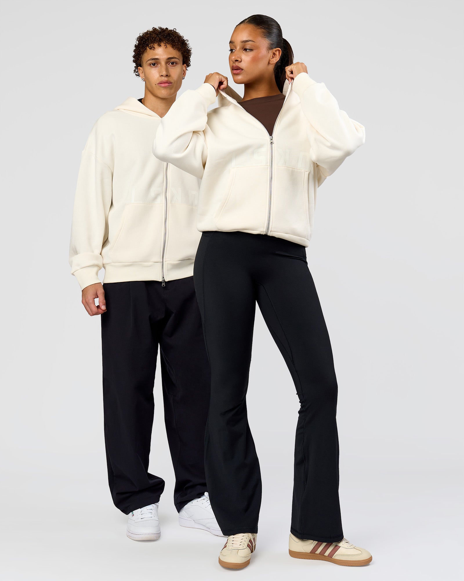 Duo wearing Shadow Mode Oversized Zip Through Hoodie - Off White | Model:Both | Size:Duo
