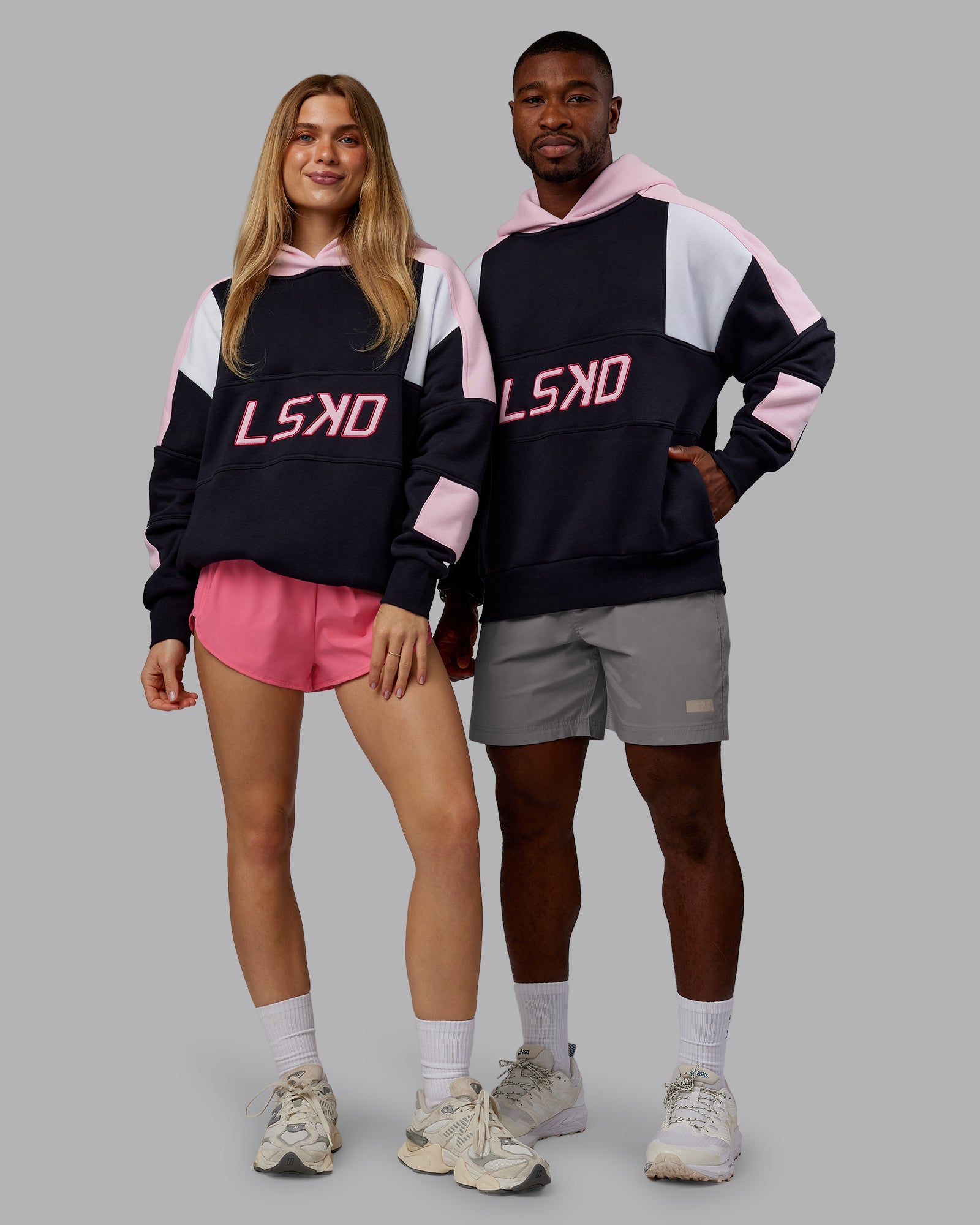 Duo wearing Slam Oversized Hoodie - Caviar-Light Bubblegum | Model:Both | Size:Duo
