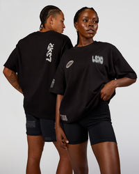 Duo wearing Static Grit Heavyweight Oversized Tee - Black-Alloy | Model:Both | Size:Duo