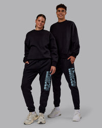 Duo wearing Static Track Pant - Black-Skyride | Model:Both | Size:Duo